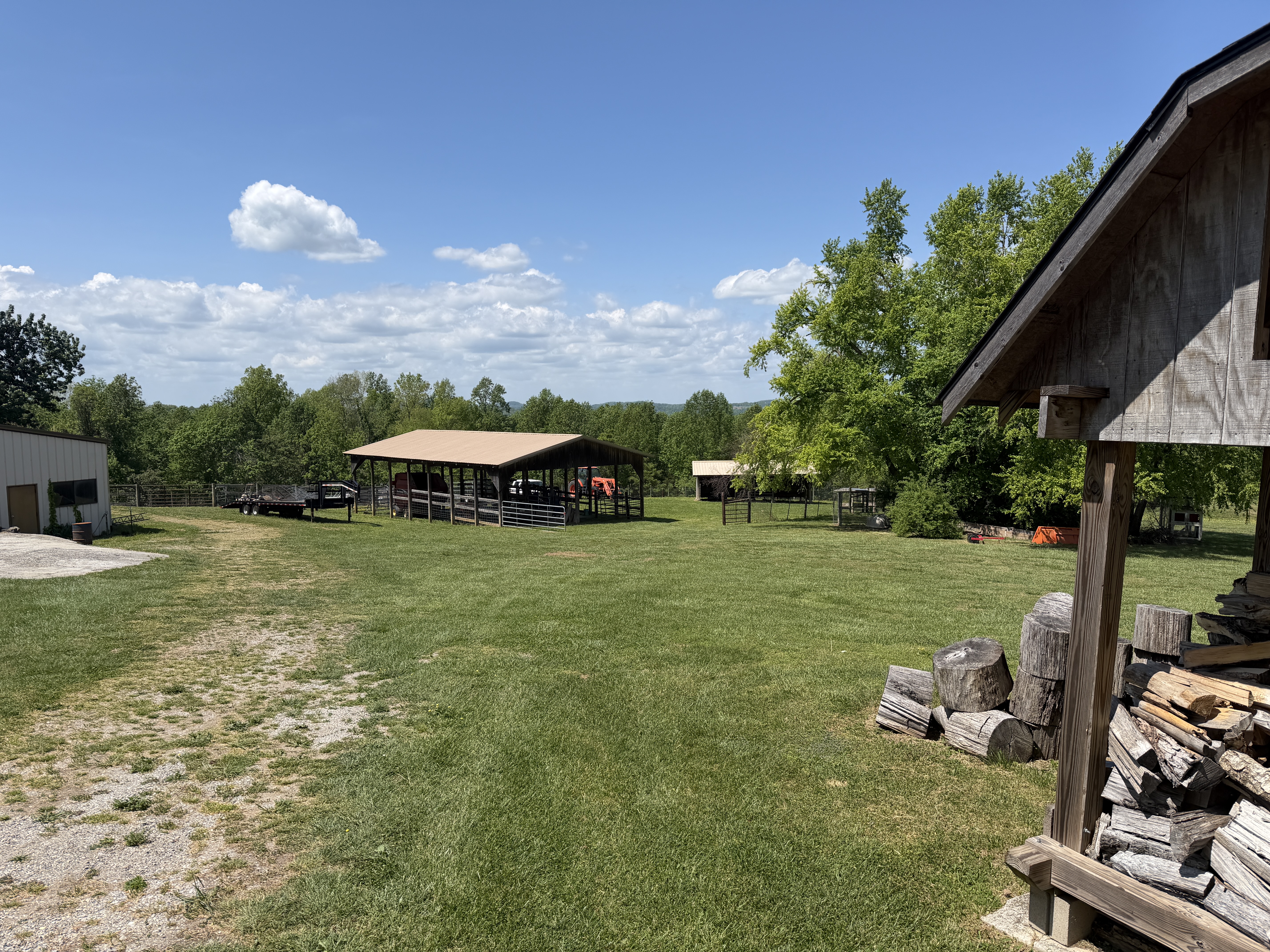 Wide view of farm buildings and open grounds